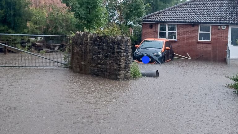 Handout photo taken with permission from the Twitter feed of @CloudsHillBirds of flooding in Port Talbot, Wales