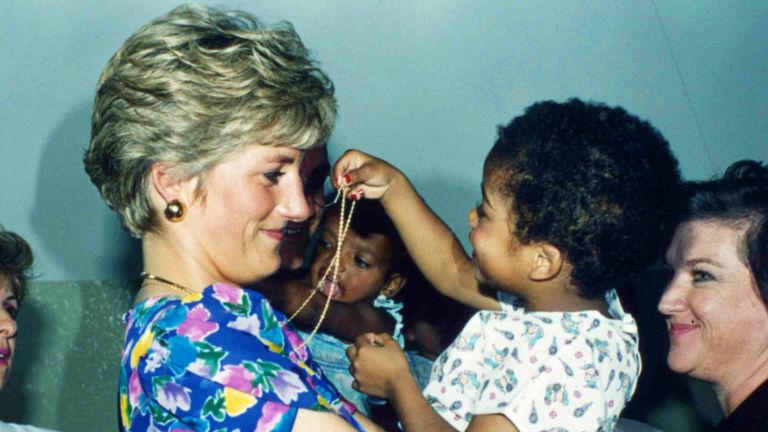 FILE - In this April 24, 1991 file photo, Britain&#39;s Princess Diana, the Princess of Wales, hugs and plays with an HIV positive baby in Faban Hostel, San Paulo, on the second day of her visit to Brazil 
PIC:AP