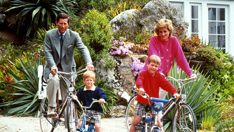 The Prince and Princess of Wales with sons Prince William, right, and Prince Harry prepare for a cycling trip in Tresco during their holiday in the Scilly Isles.