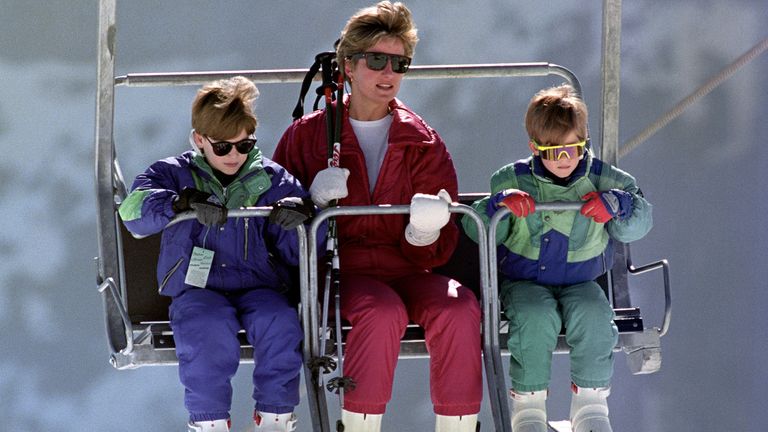 The Princess of Wales rides a chair lift up the Kriegerhorn with her sons Prince William, left, and Prince Harry, in Lech, Austria.  10-Apr-1991