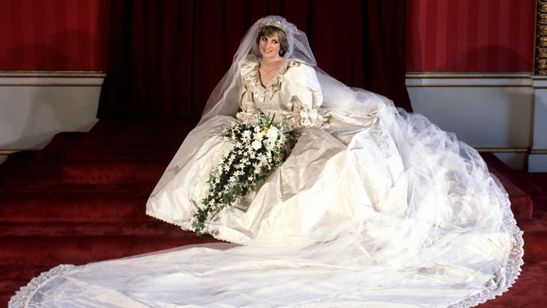 The Princess of Wales seated in her bridal gown at Buckingham Palace after her marriage to Prince Charles at St. Paul&#39;s Cathedral.