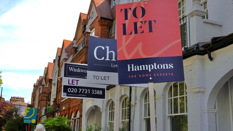 London, UK-June 8, 2021: Real estate agent "To let" signs in front of terrace house in London.