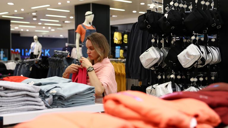 A shopper checks products inside a Primark store at Oxford Street, after its reopening amid the spread of the coronavirus disease (COVID-19) in London, Britain June 15, 2020. REUTERS/Hannah McKay