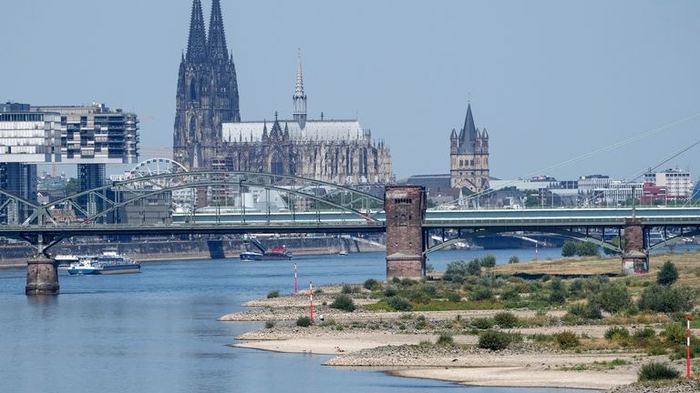 The river Rhine is pictured with low water in Cologne, Germany, Wednesday, Aug. 10, 2022. The low water levels are threatening Germany&#39;s industry as more and more ships are unable to traverse the key waterway. Severe drought will worsen in Europe in August as a hot and dry summer persists. (AP Photo/Martin Meissner)