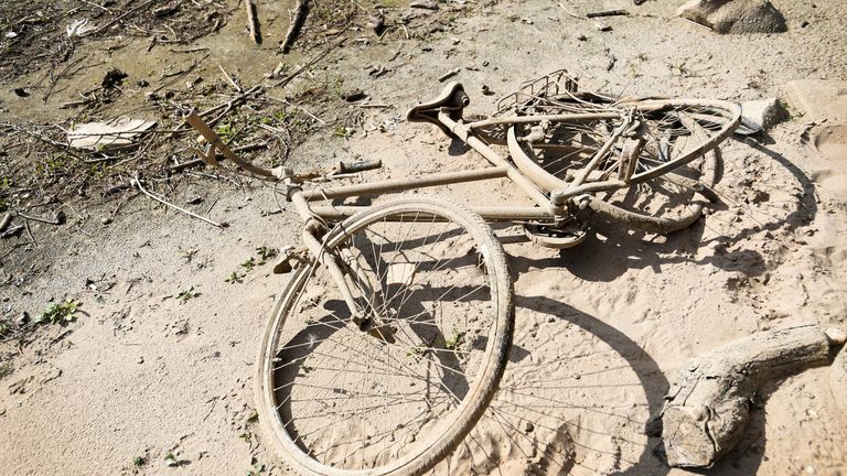 A view of a bicycle that reemerged due to the low water level at a river bed of the Rhine River in Lobith, Netherlands August 8, 2022. REUTERS/Piroschka van de Wouw
