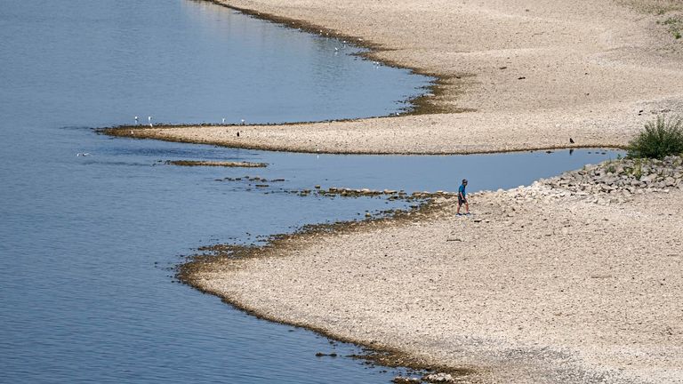 The river Rhine is pictured with low water in Cologne, Germany, Wednesday, Aug. 10, 2022. The low water levels are threatening Germany&#39;s industry as more and more ships are unable to traverse the key waterway. Severe drought will worsen in Europe in August as a hot and dry summer persists. (AP Photo/Martin Meissner)