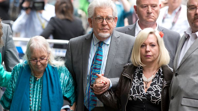 Entertainer Rolf Harris, his wife Alwen and daughter Bindi (R) leave Southwark Crown Court in London June 30, 2014. Harris, a mainstay of family entertainment in Britain and Australia for more than 50 years, was found guilty on Monday of 12 charges of indecently assaulting young girls over a period of nearly 20 years.  REUTERS/Neil Hall ( BRITAIN - Tags: CRIME LAW ENTERTAINMENT)