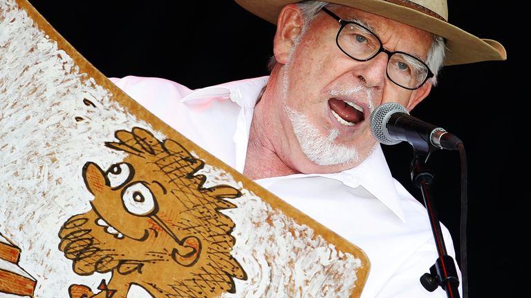 Australian singer Rolf Harris performs with his wobbleboard at the Glastonbury Festival 2010 in south west England, June 25, 2010.   REUTERS/Luke MacGregor (BRITAIN - Tags: ENTERTAINMENT SOCIETY)