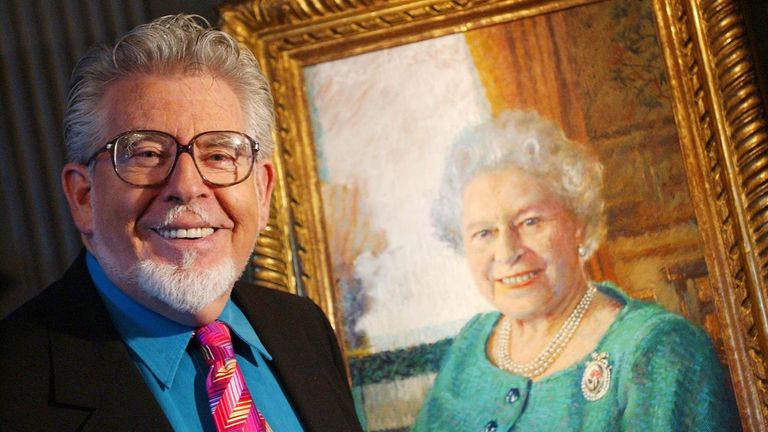 Rolf Harris chats to members of the press about his portrait of Her Majesty The Queen at the Palace of Holyroodhouse.