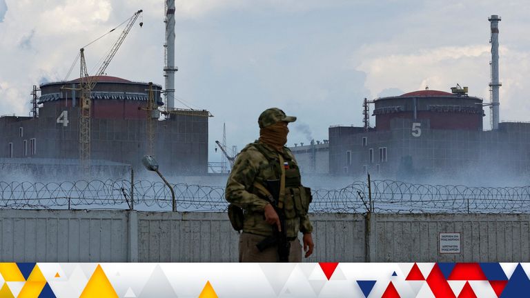 A serviceman with a Russian flag on his uniform stands guard near the Zaporizhzhia Nuclear Power Plant in the course of Ukraine-Russia conflict outside the Russian-controlled city of Enerhodar in the Zaporizhzhia region, Ukraine