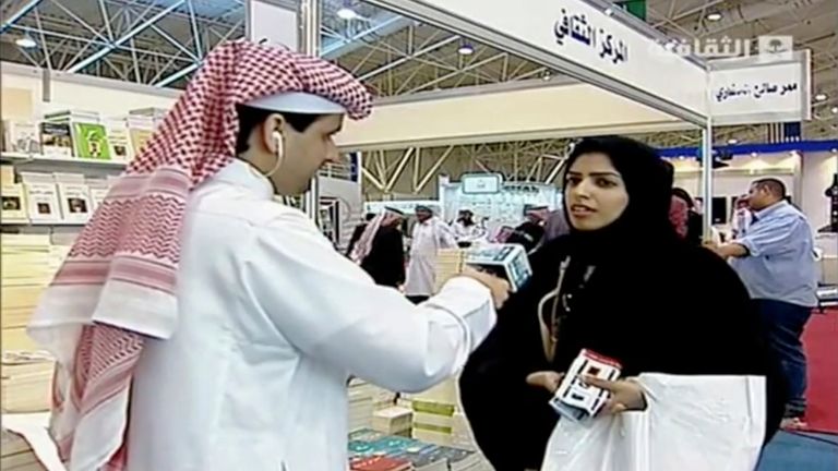 In this frame grab from Saudi state television footage, doctoral student and women&#39;s rights advocate Salma al-Shehab speaks to a journalist at the Riyadh International Book Fair in Riyadh, Saudi Arabia, in March 2014. A Saudi court has sentenced al-Shehab to 34 years in prison for spreading "rumors" on Twitter and retweeting dissidents, according to court documents obtained Thursday, Aug. 18, 2022, a decision that has drawn growing global condemnation. (Saudi state television via AP)