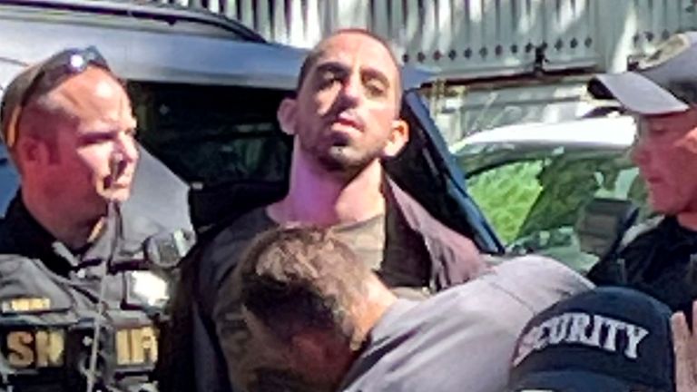 A person was pictured being detained outside the Chautauqua Institution. Photo: AP