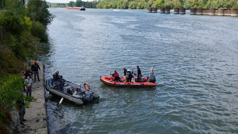 The French fire brigade on rubber boats tracking the beluga whale Pic: AP