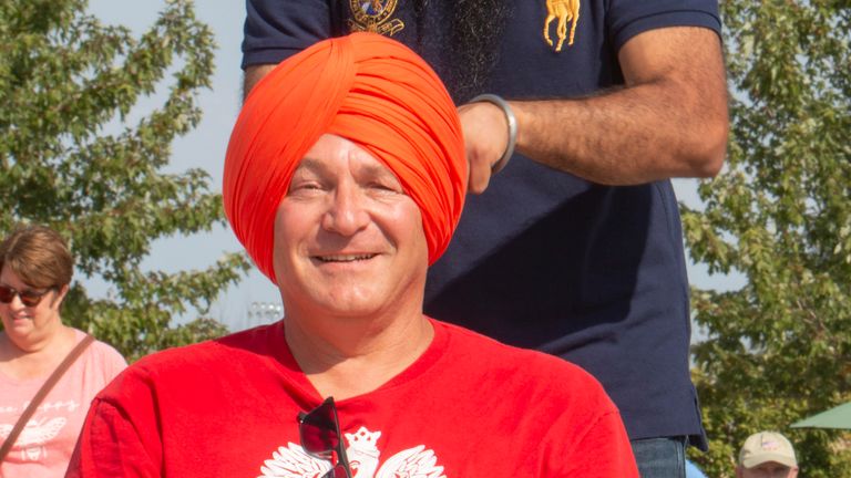 Mayor Daniel Bukiewicz gets a turban tied at the Chardi Kala community event. Pic: Leslie Flynn