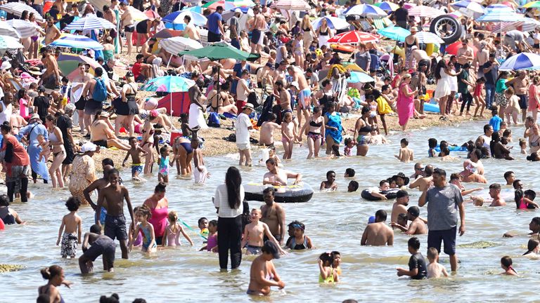 People gather in the hot weather at Southend-on-Sea beach. A drought has been declared for parts of England following the driest summer for 50 years