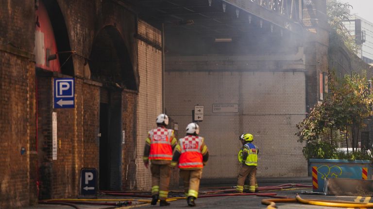 Emergency personnel attending the scene of a fire in an arch under the railway in Union Street, Southwark, London. Picture date: Wednesday August 17, 2022.

