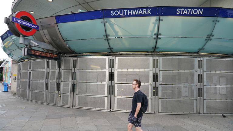 A man walks past Southwark Station, closed due to strike action 