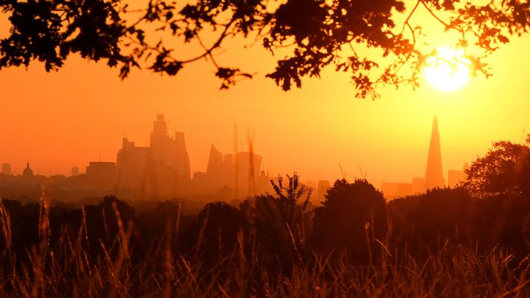 The sun rises above the London skyline, as a second heatwave is predicted for parts of the country, in London, Britain, August 11, 2022. REUTERS/Toby Melville

