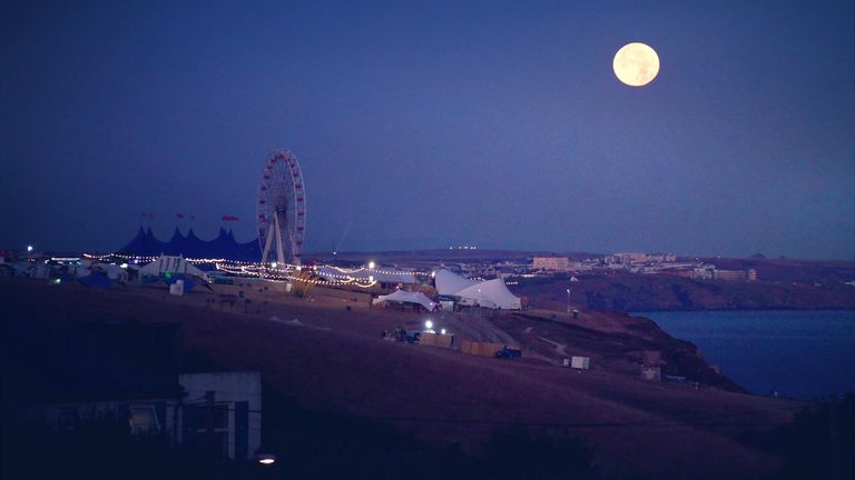 Supermoon in Newquay, Cornwall with the Boardmasters event site in the foreground.
PIC:Ed Bayliss