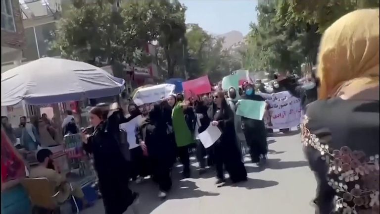 Woman and girls protest against restrictions brought in since the Taliban returned one year ago