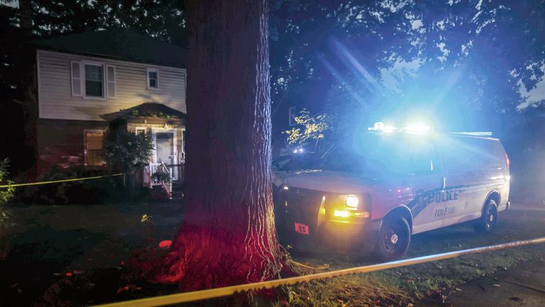 First responders to the scene at a home where a woman was crushed to death by a fallen tree on Monday, August 29, 2022 in Toledo, Ohio.  The intense storms brought high winds, heavy rain and flash flooding to parts of the Midwest and South.  (Isaac Ritchey / The Blade via AP)