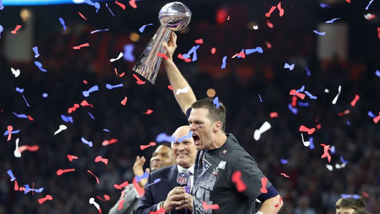 New England Patriots' quarterback Tom Brady holds the Vince Lombardi trophy as interviewer Terry Bradshaw approaches after his team defeated the Atlanta Falcons to win Super Bowl LI in Houston, Texas, USA on February 5, 2017. REUTERS / Adrees Latif