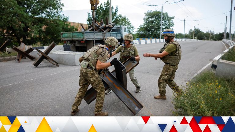 Ukrainian soldiers prepare road blocks in Bakhmut as Russian forces prepare to take the city 