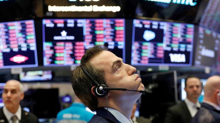 A trader works on the floor of the New York Stock Exchange shortly before the closing bell as the market takes a significant dip in New York, U.S., February 25, 2020
