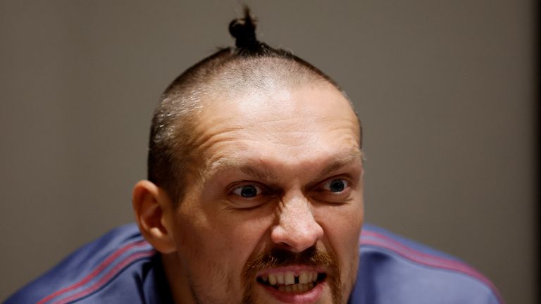 Oleksandr Usyk sports his chub haircut during a media event on 15 August