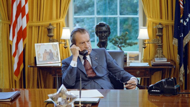 U.S. President Richard Nixon seated at his desk, with family photos and the Lincoln bust statuette visible behind him, in the White House Oval Office in Washington, U.S. on June 23, 1972. Courtesy The Nixon Library and Museum/Handout via REUTERS ATTENTION EDITORS - THIS IMAGE WAS PROVIDED BY A THIRD PARTY. EDITORIAL USE ONLY.