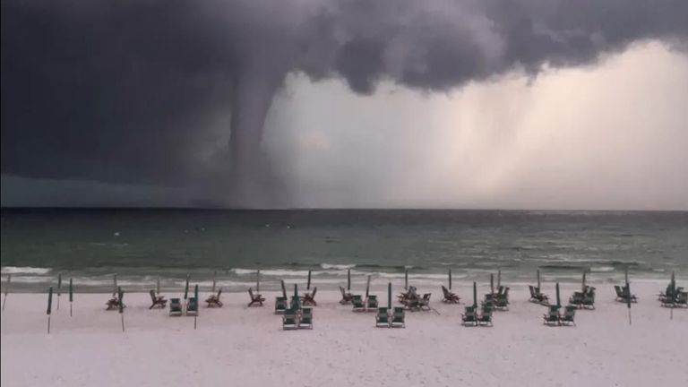 A large waterspout formed Tuesday morning off Destin in northwest Florida.