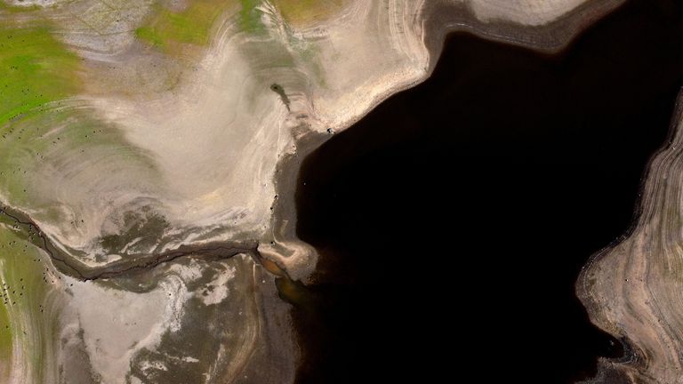 Cracks can be seen on dried up bed of Tittesworth Reservoir, in Leek, Britain, August 12, 2022. REUTERS/Carl Recine
