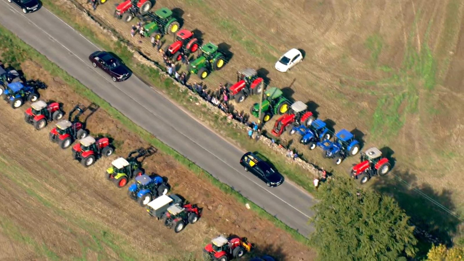 Queen dies Farmers form guard of honour with tractors as Queen's