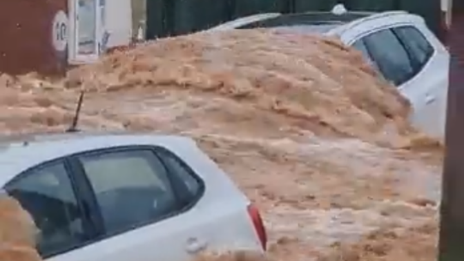 Heavy rainfall washes away cars in Spain as emergency services inundated with calls