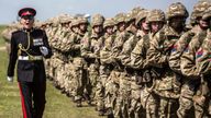 Soldiers of the Royal Artillery march to their positions as they prepare for the arrival of Britain&#39;s Queen Elizabeth to their Larkhill camp on Salisbury plain to take part in the Artillery&#39;s 300th anniversary celebrations, near Salisbury, Britain. REUTERS/Richard Pohle/Pool