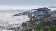 Waves roll in near a damaged house built close to the shore as Hurricane Fiona, later downgraded to a post-tropical cyclone, passes the Atlantic settlement of Port aux Basques, Newfoundland and Labrador, Canada September 24, 2022. Courtesy of Wreckhouse Press/Handout via REUTERS NO RESALES. NO ARCHIVES. THIS IMAGE HAS BEEN SUPPLIED BY A THIRD PARTY. MANDATORY CREDIT