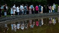 Residents of a compound line up for coronavirus testing following an outbreak in Chengdu, Sichuan province