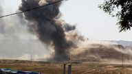 Smoke rises from the headquarters of the Kurdistan Freedom Party after a strike on the outskirts of Kirkuk