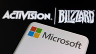 Microsoft logo is seen on a smartphone placed on displayed Activision Blizzard logo in this illustration taken January 18, 2022. REUTERS/Dado Ruvic/Illustration/File Photo
