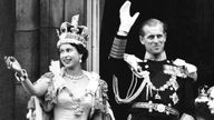 File photo dated 2/6/1953 of Queen Elizabeth II, wearing the Imperial State Crown, and the Duke of Edinburgh, dressed in uniform of Admiral of the Fleet, as they wave from the balcony to the onlooking crowds at the gates of Buckingham Palace after the Coronation. 