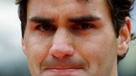 FILE PHOTO: Roger Federer of Switzerland cries as he receives his trophy after winning the men&#39;s final against Robin Soderling of Sweden at the French Open tennis tournament at Roland Garros in Paris June 7, 2009. REUTERS/Regis Duvignau/File Photo