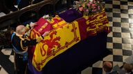 King Charles III places the the Queen&#39;s Company Camp Colour of the Grenadier Guards on the coffin