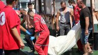 Syrian Red Crescent workers recover one of the bodies in Tartus