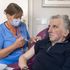 Registered Nurse Laura Hastings administers a covid booster to Andrew Young, 72, at Victoria Manor Care home in Edinburgh to launch the winter vaccine programme. Picture date: Monday September 5, 2022.