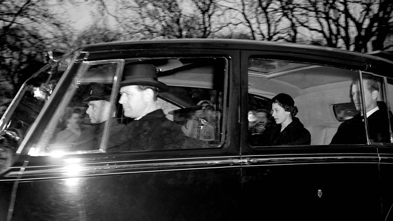 Queen Elizabeth II, whose accession to the throne was publicly proclaimed, drives from Clarence House, her residence as Princess, with the Duke of Edinburgh. She was to leave London for Sandringham.