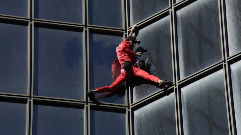 French &#39;Spiderman&#39; Alain Robert climbs the TotalEnergies skyscraper in Paris
