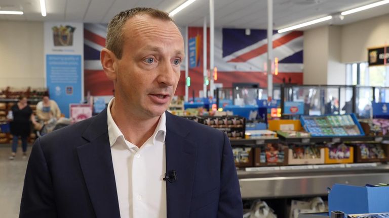Aldi has pledged to continue to offer the lowest grocery prices in the UK despite suffering a steep fall in profits.