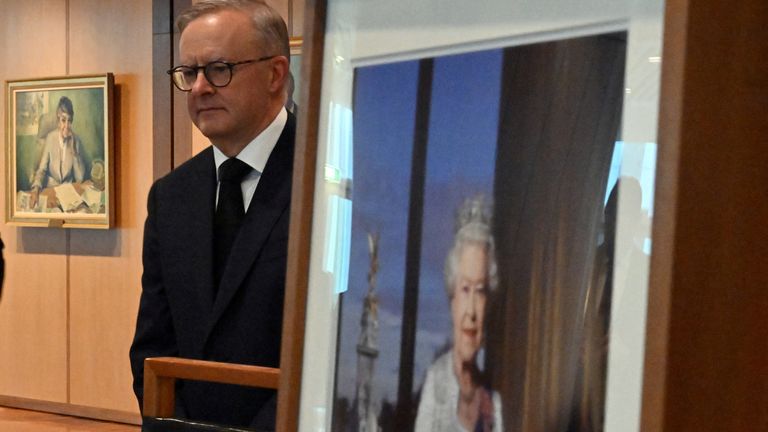 Prime Minister Anthony Albanese stands near an image of Queen Elizabeth II after her death, after signing the condolence book at Parliament House in Canberra, Australia, September 9, 2022. AAP Image / Mick Tsikas via REUTERS ATTENTION EDITORS - THIS IMAGE IS PROVIDED BY A THIRD PARTY.