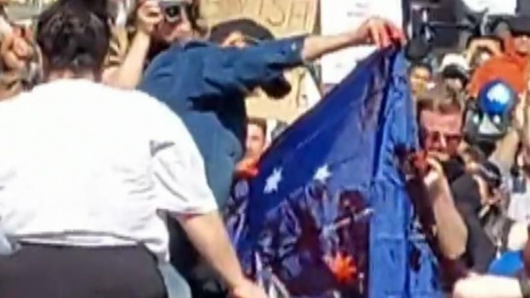 Protesters shouted &#39;abolish the monarchy&#39;, and defaced the Union Jack part of the Australian flag. 