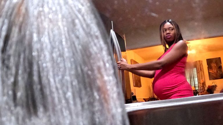 Ashley Tose, a seven-months-pregnant woman, stands in her mother&#39;s kitchen as water runs from a faucet, while the city of Jackson and areas around it are to go without reliable drinking water indefinitely after pumps at the water treatment plant failed, leading to the emergency distribution of bottled water and tanker trucks for 180,000 people, in Clinton, near Jackson, Mississippi, U.S., August 31, 2022. REUTERS/Carlos Barria TPX IMAGES OF THE DAY REFILE - CORRECTING LOCATION
